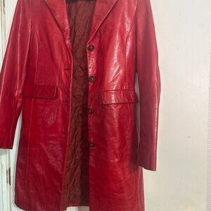 Transmission shiny red leather trench coat